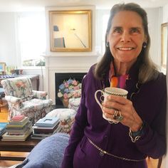 a woman holding a coffee cup in her hands