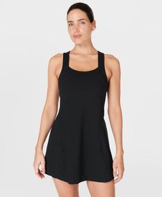 Our sporty new workout dress for styling out the sweatiest of sessions. Sweat-wicking Power Pro fabric is breathable and stretchy with a matte finish. Slim, body-skimming fit with contrasting panels and a flattering racerback. Supportive inner shorts with slip pocket. In-built bra with removable pads. Length: 77.5cm / 31". Model wears size S and is 178cm/5'10" tall. Style Code: SB9287BColour: Black Sporty Tennis Dress With Built-in Bra For Gym, Black Tennis Dress With Built-in Bra, Workout Dresses With Built-in Bra And Racerback, Fitted Tennis Dress With Built-in Bra For Gym, Solid Sleeveless Tennis Dress For Workout, Sleeveless Solid Tennis Dress For Workout, Athleisure Elastane Activewear With Scoop Neck, Scoop Neck Elastane Activewear For Sports, Fitted Moisture-wicking Activewear With Scoop Neck