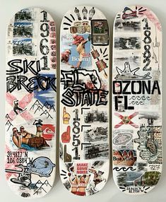 three skateboards with different designs on them