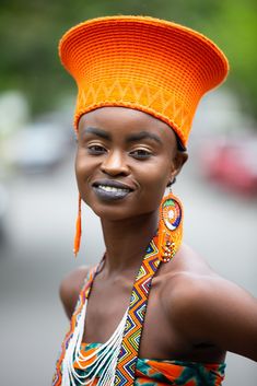 This elegant Zulu Basket Hat is the perfect accessory to upgrade any outfit. This piece is handmade by female artisans in South Africa. The hat is made out of woven grass, polyester cloth patterned with cotton, wool threads, and decorative glass beads. It can be worn on special occasions like birthdays, weddings, and formal gatherings. As with all handmade items, no two pieces are the same. Head Size - 23' African Traditional Hats For Women, Zulu Beads Outfit, Zulu Hats South Africa, Faces Anatomy, Zulu Attire, African Headdress, African Aesthetics, Zulu Hat, Zulu Baskets