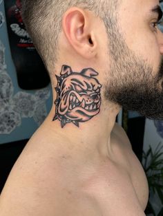 a man with a tattoo on his neck