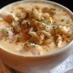 a white bowl filled with soup on top of a table