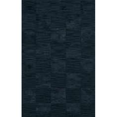 an area rug with black squares on the front and back, in various sizes and colors