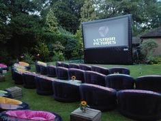 an outdoor movie is set up on the lawn