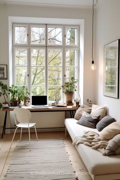 a living room filled with furniture and a large window covered in lots of windowsills