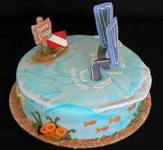 there is a cake that has been decorated with an image of a man on the beach