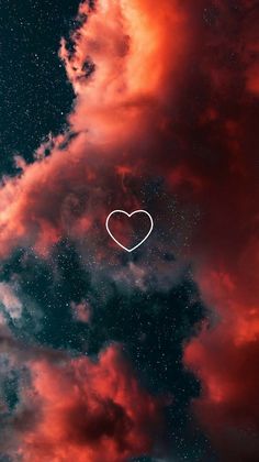 a heart shaped object floating in the sky with clouds and stars around it, surrounded by red hues