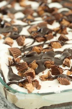 a dessert dish with chocolate and marshmallows on top in a glass dish