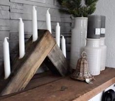 some candles are sitting on a shelf next to other items