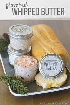 bread, jams and whipped butter on a tray with pine cones in the background