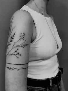 a woman with a tattoo on her arm