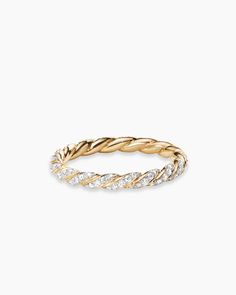 an 18k gold ring with diamonds on the inside and outside, set against a white background