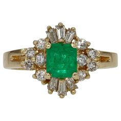 This vintage emerald cocktail ring is a beautiful and affordable statement piece for any jewelry collection. Crafted from 14 karat yellow gold and featuring over 3/4 carats total of sparkling diamonds. Centering on a sustainable 0.60 carat emerald displaying elegant rich hues. The classic ballerina design makes a pleasant announcement. A perfect estate piece that could be a fab gemstone engagement ring to round out your treasure chest.   Condition: Excellent Era: Retro Year: 1980s Metal: 14k Yel Ballerina Engagement Ring, Emerald Cocktail Ring, Emerald Cocktail, Cocktail Vintage, Emerald Color, Gemstone Engagement Rings, Emerald Diamond, Sparkle Diamonds, Jewelry Rings Engagement