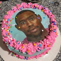 a cake with a photo of a man on it