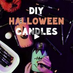 someone is decorating their halloween candles with the words diy halloween candles on it