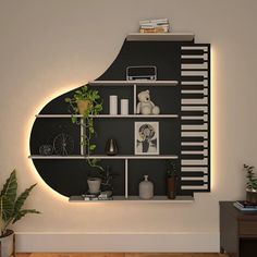 a living room filled with furniture and a wall mounted book shelf next to a potted plant