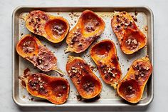 baked sweet potatoes on a baking sheet ready to be cooked in the oven for dinner