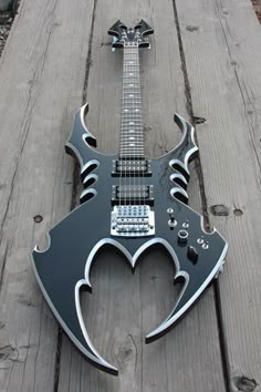 an electric guitar is shaped like a heart