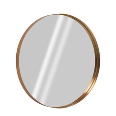 a round mirror with a gold rim on a white background, it is isolated from the side