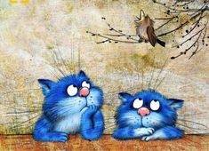 two blue cats sitting next to each other on top of a wooden table with a bird flying above them