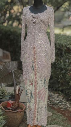 a mannequin wearing a dress with sequins on it