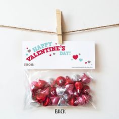 valentine's day candy wrapped in cellophane and tied to a clothes line