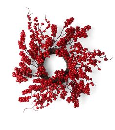 red berries are arranged in the shape of a wreath