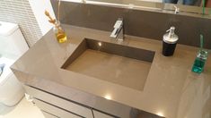 a bathroom sink with a faucet and soap dispenser