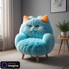 a blue cat chair sitting on top of a wooden table