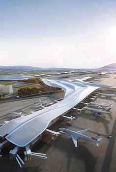 an aerial view of the airport with many planes parked on the tarmac and in front of it