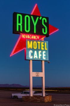 a motel sign in the middle of nowhere