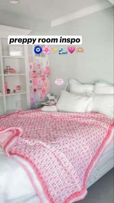 a bed with white sheets and pink bedspread in a room that has shelving on the wall