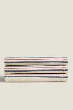 two striped towels sitting on top of each other