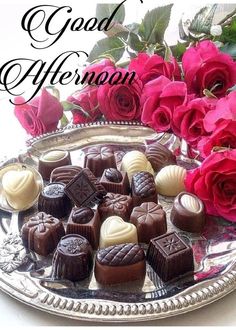 chocolates and roses on a silver platter