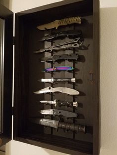 there are many knives in the shadow box