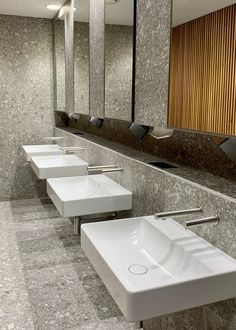 a row of sinks in a public restroom