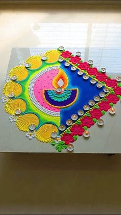 an artistically decorated diya on display in a store window