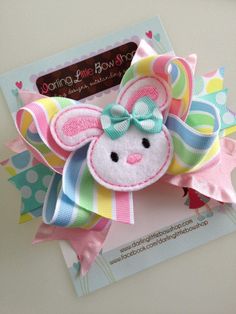 a close up of a hair bow on a card