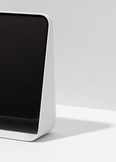 a computer monitor sitting on top of a white table