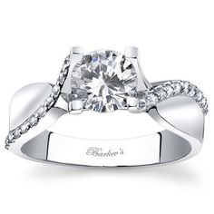 a white gold engagement ring with diamonds on it