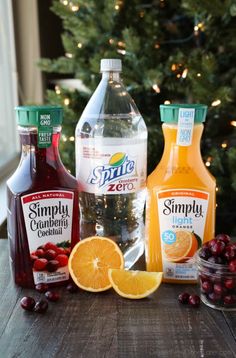 bottles of orange juice, cranberries, and other condiments on a table