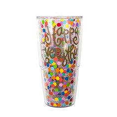 a plastic cup filled with lots of colorful confetti