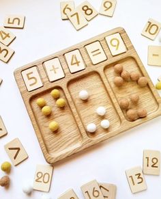 a wooden board with numbers and dices on it