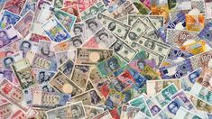 many different types of currency are arranged together in this image, including one hundred and twenty dollars