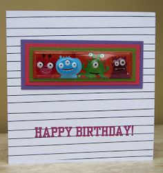 a happy birthday card with three little monsters on the front and one in the back