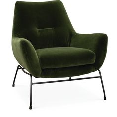 a green velvet chair with black metal legs