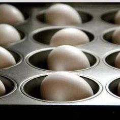 the muffin tins are filled with brown eggs