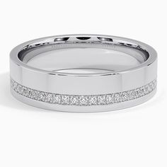 a white gold wedding band with princess cut diamonds on the sides and channeled edges