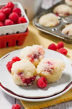 raspberry shortcakes on a plate with muffin tins in the background