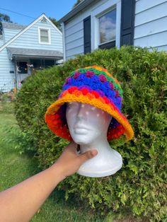 This simple and cute rainbow crochet bucket hat is made with 100% acrylic yarn. This hat is a unisex hat and is cute and simple granny stitch design.  Perfect for a cute head accessory for outfits, outings or any activities. HANDWASH AND AIRDRY THIS MATRIAL HAS A SLIGHT STRETCH Measurement of head circumference  medium adult (21-23inches) large adult (24-25inches) Multicolor Brimmed Cotton Yarn Hat, Multicolor Crochet Yarn Cap, Multicolor Knitted Cotton Yarn Hat, Adjustable Multicolor Cotton Yarn Hats, Multicolor Crochet Cotton Yarn Hat, Multicolor Knitted Crochet Hat In Cotton, Hand Knitted Multicolor Crochet Hat In Cotton Yarn, Multicolor Knitted Bucket Hat, Multicolor Hand Knitted Crochet Cotton Hat